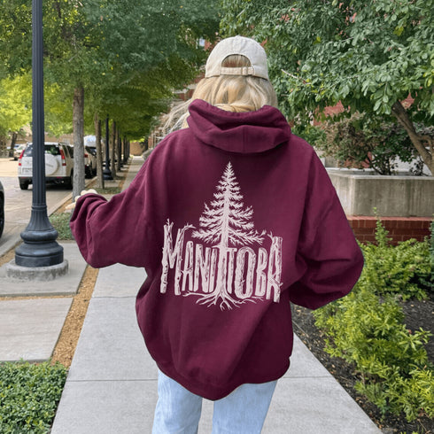 Celebrate the wild spirit of Manitoba with this eye-catching hoodie featuring "Manitoba" written in a unique tree branch font.